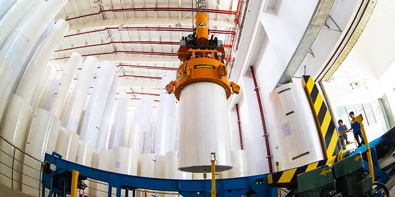 Paper Roll Handling in a Factory with Lifting Equipment